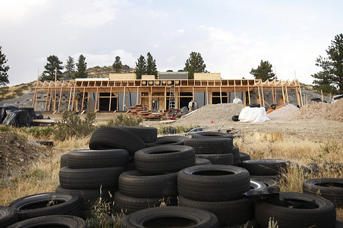 Building with tires: an earthship under construction in wheatland, wyoming