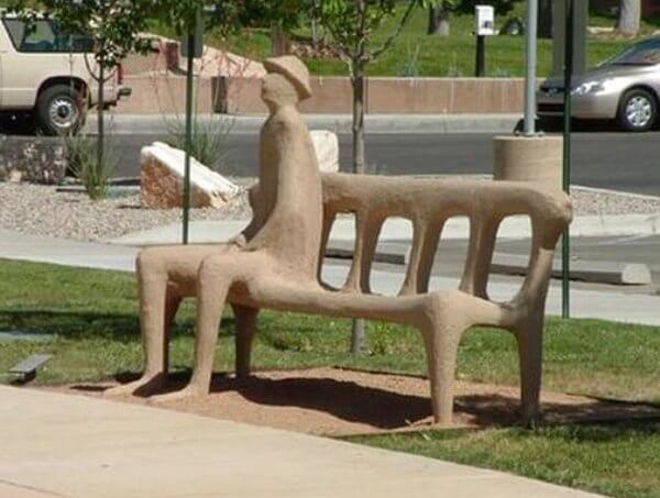 cement person molded into bench