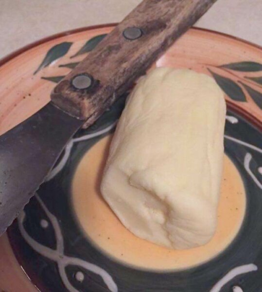 homemade butter on dish with knife