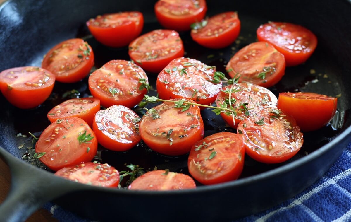 tomatoes cooking in cast iron